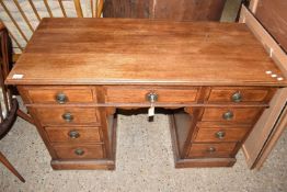 LATE 19TH CENTURY OAK TWIN PEDESTAL DESK OR DRESSING TABLE FITTED WITH NINE DRAWERS