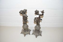 PAIR OF BRONZED SPELTER MODELS OF PUTTO