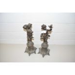 PAIR OF BRONZED SPELTER MODELS OF PUTTO