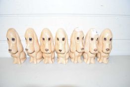 COLLECTION OF SEVEN IDENTICAL SYLVAC MODEL DOGS