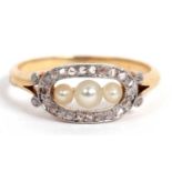 Small pearl and diamond ring featuring three graduated seed pearls in an openwork design framed with