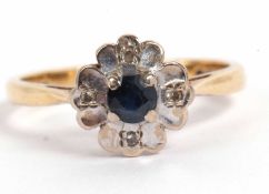 18ct gold sapphire and diamond cluster ring the central round faceted sapphire raised between