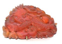 Chinese carved hard stone brooch, a dragon design framed in a gilt metal mount stamped China,