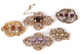 Mixed Lot: Three Victorian gold filled brooches, garnet, amethyst, citrine set together with two