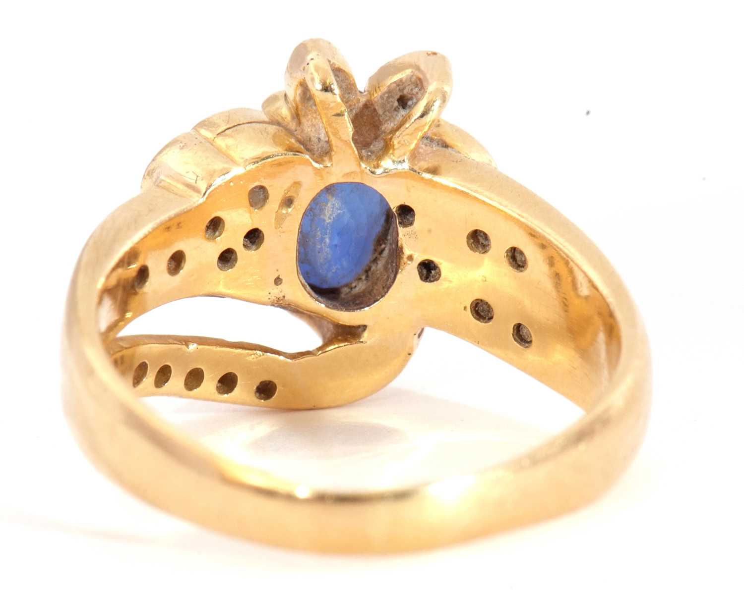 Sapphire and diamond designer ring, the oval shaped faceted sapphire four claw set between small - Image 4 of 9