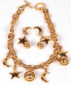 A vintage Celine Paris choker necklace and earrings, planet, star and moon design