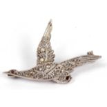 Precious metal diamond bird brooch, the bird in flight and set throughout with small rose cut