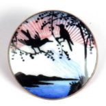 Vintage sterling enamel brooch, the circular panel with a sun setting over water, rocks and birds,
