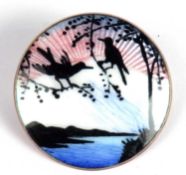 Vintage sterling enamel brooch, the circular panel with a sun setting over water, rocks and birds,