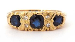 18ct gold sapphire and diamond ring featuring three graduated round cut faceted sapphires