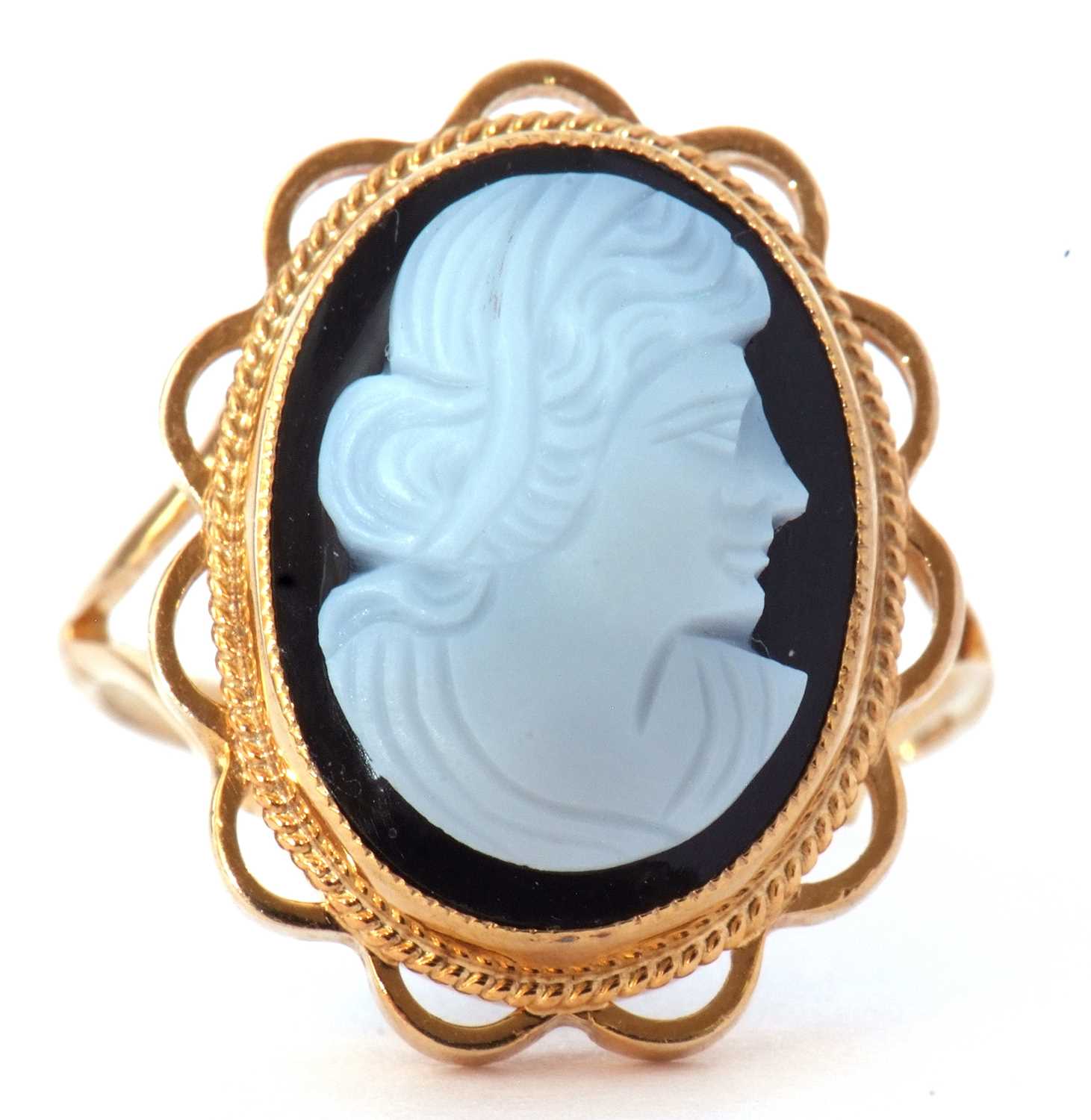 9ct gold glass cameo ring depicting a profile of a lady, bezel set in a beaded and scroll mount,