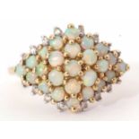 Modern 9ct gold, opal and diamond cluster ring, designed with five tiers of small graduated opals,