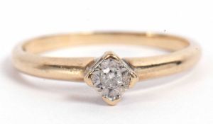 9ct gold single stone diamond ring featuring a small diamond in illusion setting, raised between