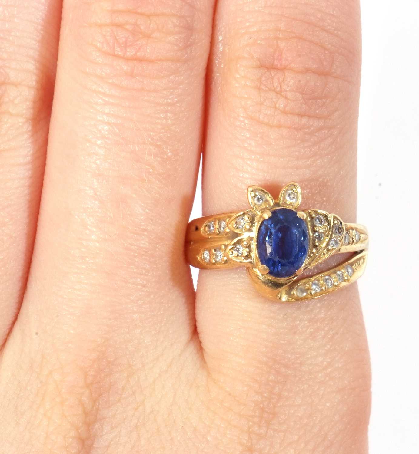 Sapphire and diamond designer ring, the oval shaped faceted sapphire four claw set between small - Image 9 of 9