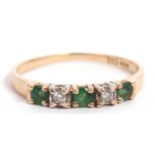 Modern emerald and diamond ring, line set with three small emeralds and two small diamonds,