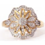 Modern 9ct gold and diamond cluster ring, the pierced panel with a flower head design, highlighted