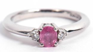 18ct gold white and pink sapphire and diamond three stone ring centering an oval faceted pink