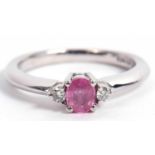 18ct gold white and pink sapphire and diamond three stone ring centering an oval faceted pink