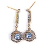 Pair of pale sapphire and diamond drop earrings, each circular sapphire suspended in a small old cut