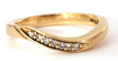Modern seven stone diamond ring, an angular design set with seven small round cut diamonds,