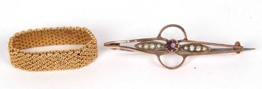 Mixed lot including a yellow metal flexible bead decorated ring, together with a yellow metal brooch
