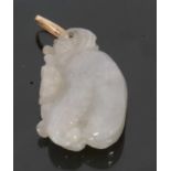 Modern pale carved jade pendant, figure of a seated animal, 35 x 20cm