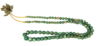 Single row of graduated jade beads, 4mm - 10mm, chord strung, 40mm long