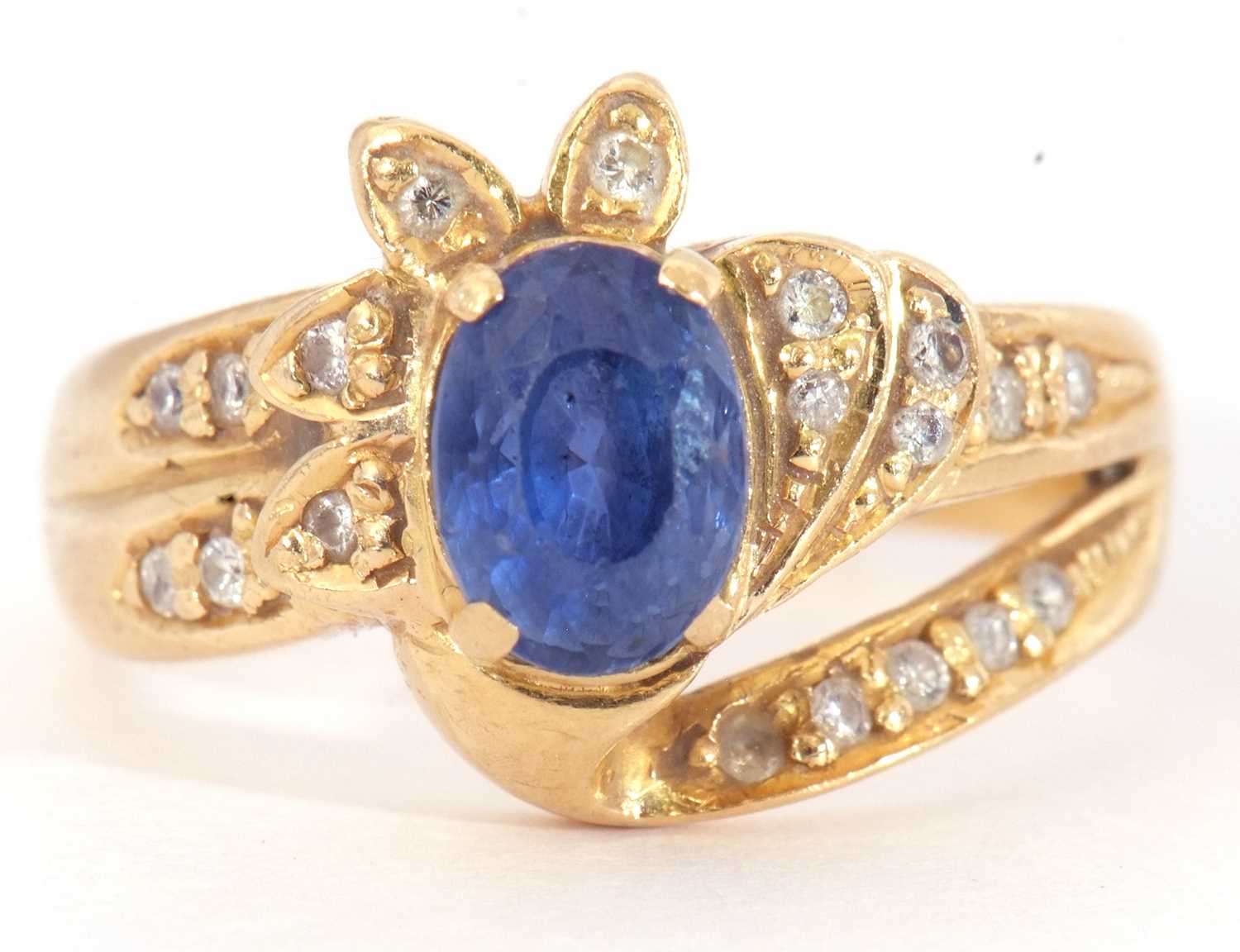 Sapphire and diamond designer ring, the oval shaped faceted sapphire four claw set between small - Image 2 of 9