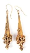 Pair of antique gold drop earrings designed as fluted beaded batons and applied with scroll and bead