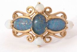 Modern 9ct gold and opalescent ring featuring three oval cut and glass backed opalescents, and