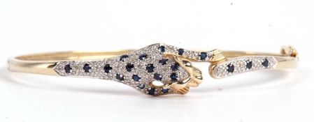 Modern 9ct gold panther hinged bracelet, the top section modeled as a panther and highlighted with