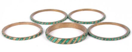 Group of five vintage brass and malacite inlaid bangles (one with a piece missing)