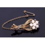 9ct gold seed pearl and diamond brooch, a floral spray design featuring five small seed pearls and