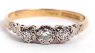 Three stone diamond ring featuring three small diamonds in illusion settings all in a pierced