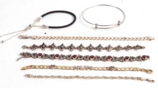 Mixed Lot: Five modern 925 stamped bracelets, two set with coloured stones, together with a torque