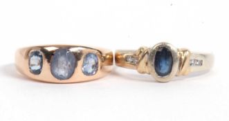 Mixed Lot: Modern blue stone ring, bezel set between small diamond highlighted shoulders, stamped