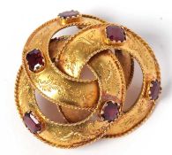 Antique high-grade yellow metal amethyst set brooch, a design with three entwined circles each