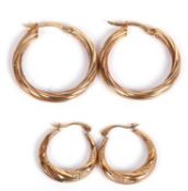 Two pairs of yellow metal hoop earrings marked 9kt and 375, g/w 2.2gms