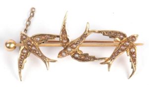 Vintage 'diving bird' brooch set throughout with small graduated seed pearls and stamped 15ct, 4cm