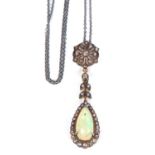 Opal and diamond drop pendant, a pear shaped opal and diamond cluster pendant suspended from a