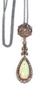 Opal and diamond drop pendant, a pear shaped opal and diamond cluster pendant suspended from a