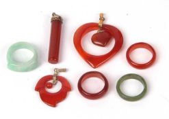 Mixed lot to include a modern pale green jade ring, modern carnelian rings (2), pendants (3)