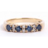 9ct gold sapphire and diamond ring featuring four small round faceted cut sapphires and six small