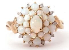 9ct gold opalescent and diamond cluster ring featuring oval and graduated round cabochon