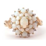 9ct gold opalescent and diamond cluster ring featuring oval and graduated round cabochon