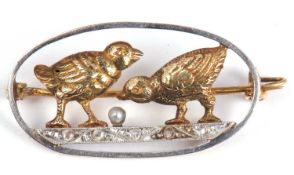 Precious metal diamond and pearl set bird brooch, the oval open work brooch with two birds