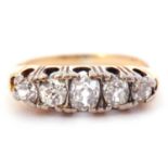 Antique 5 stone diamond ring featuring five old cut diamonds individually claw set in a pierced