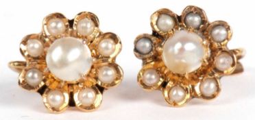 Pair of yellow metal and pearl cluster earrings, a flower head design with small graduated seed
