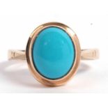 9ct gold and turquoise ring, the oval cabochon turquoise bezel set in a plain polished mount,