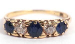 Sapphire and diamond five stone ring having three graduated round sapphires and two old cut diamonds